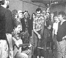 'Wimoweh' session, September 1992. (Left to right;) Pat McInherney (back to camera), Leo Kottke (seated), Pam Rose, Emily Saliers, Odetta, Amy Ray, Nanci Griffith, Ray Huskey Jr., Marlin Griffith, James Hooker, Narry Tashian, Jim Rooney, John Gorka,Dave Mallett, and John Prine. �1993 RHINO RECORDS,INC. PHOTO: BETH GWINN 
