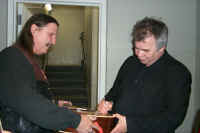 Jojo getting guitar signed by John Prine
